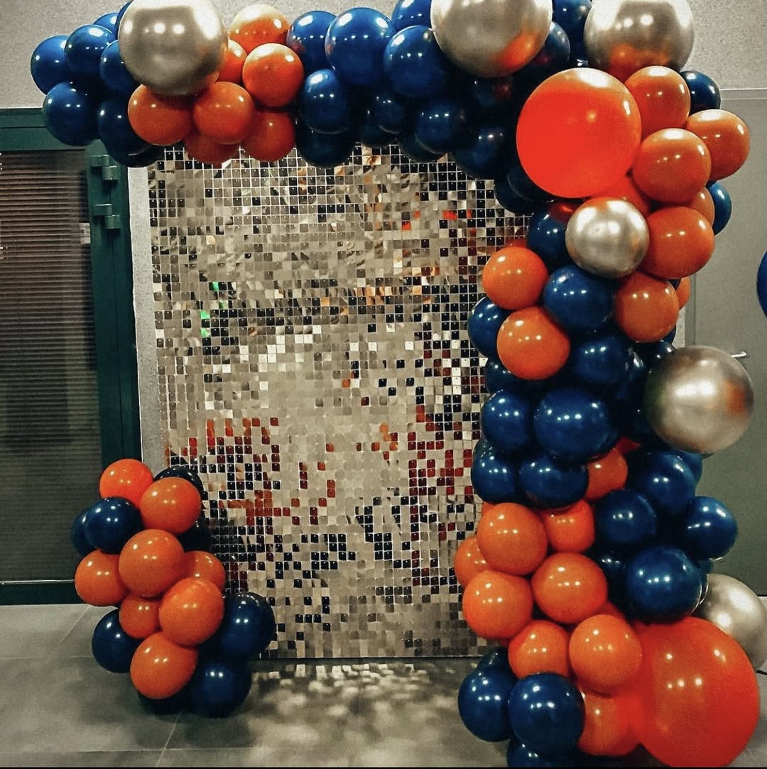 Silver shimmer panels · blue & orange balloons