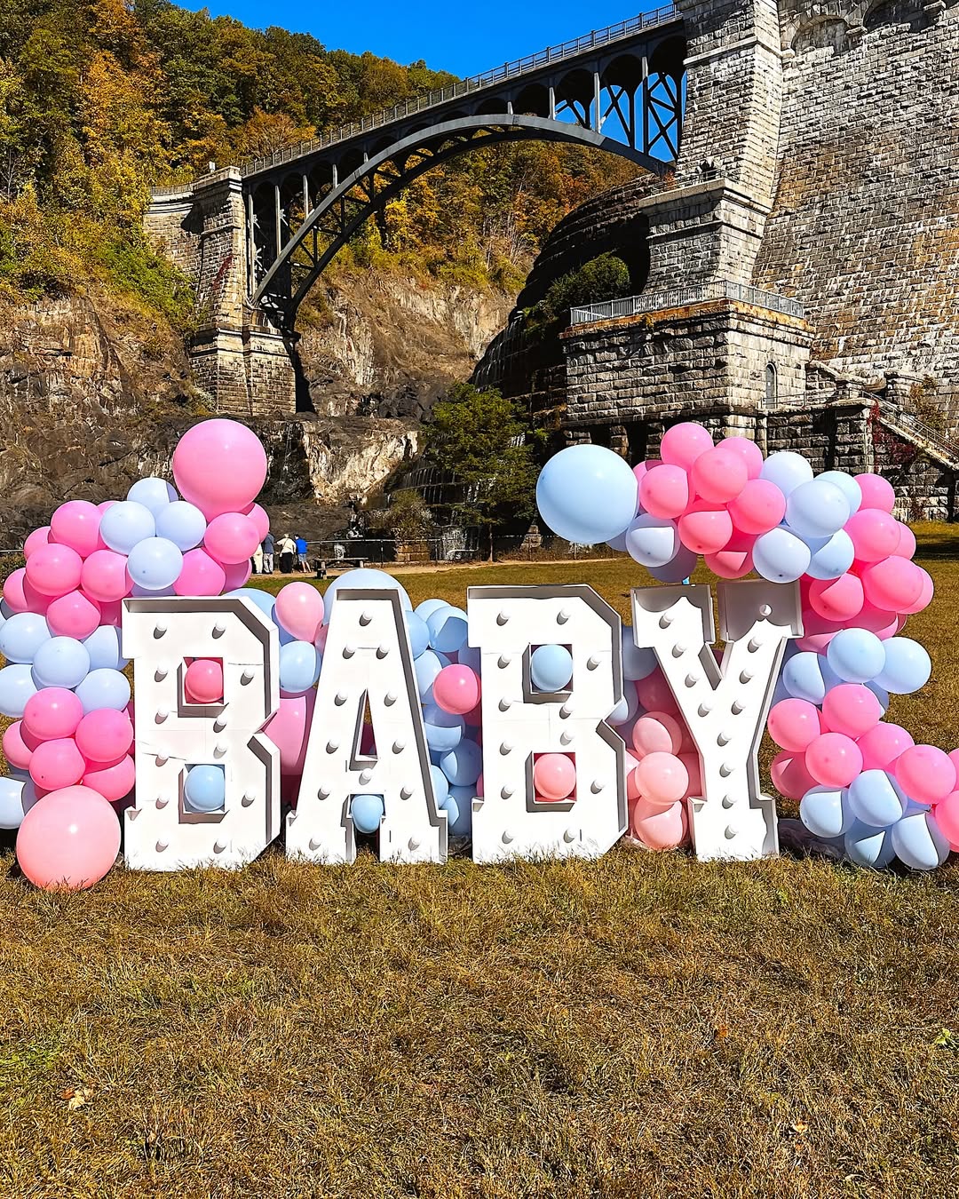 Party Land gender reveal: BABY marquee letters & balloons
